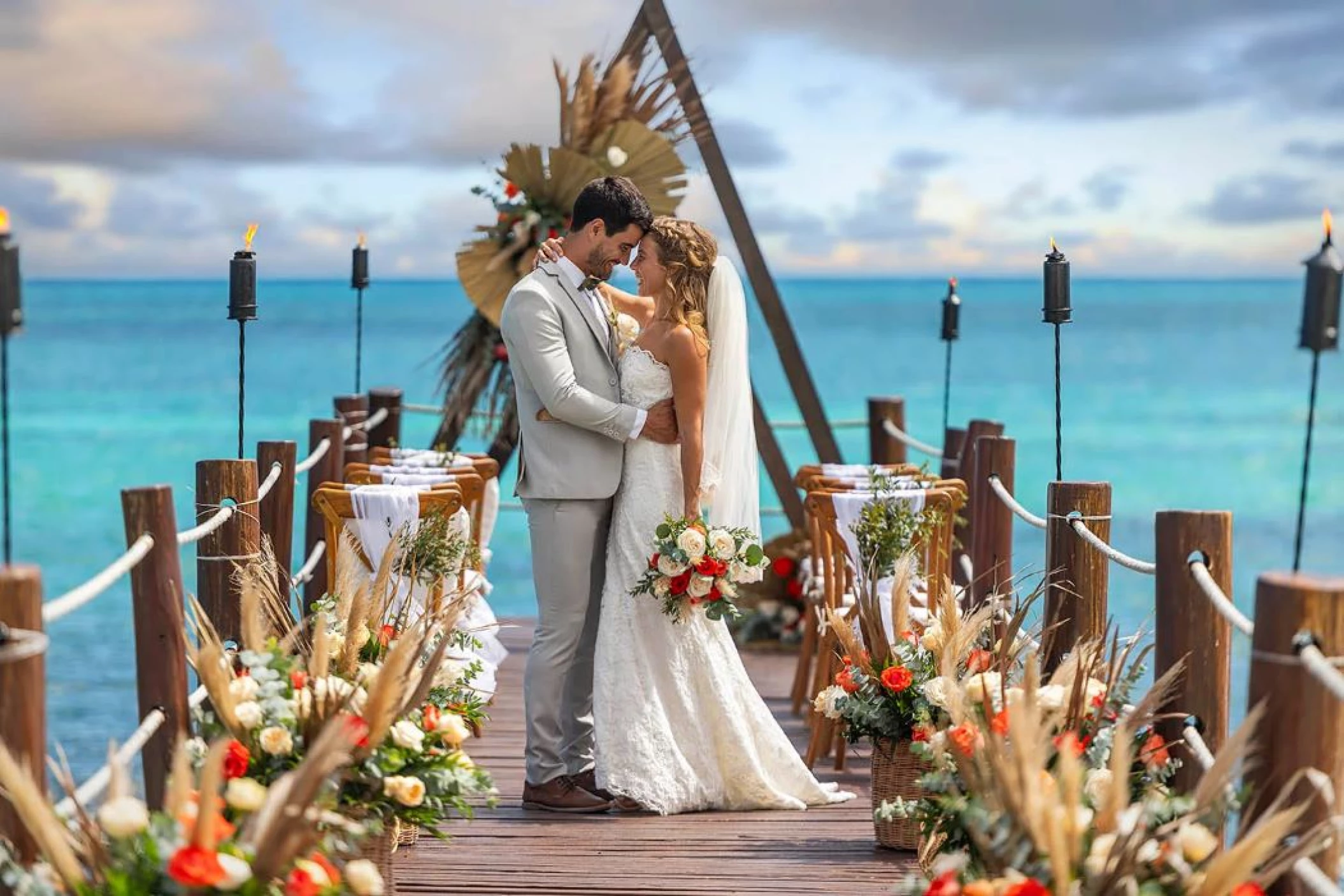 bride and groom on the pier venue at Ocean Maya Royale