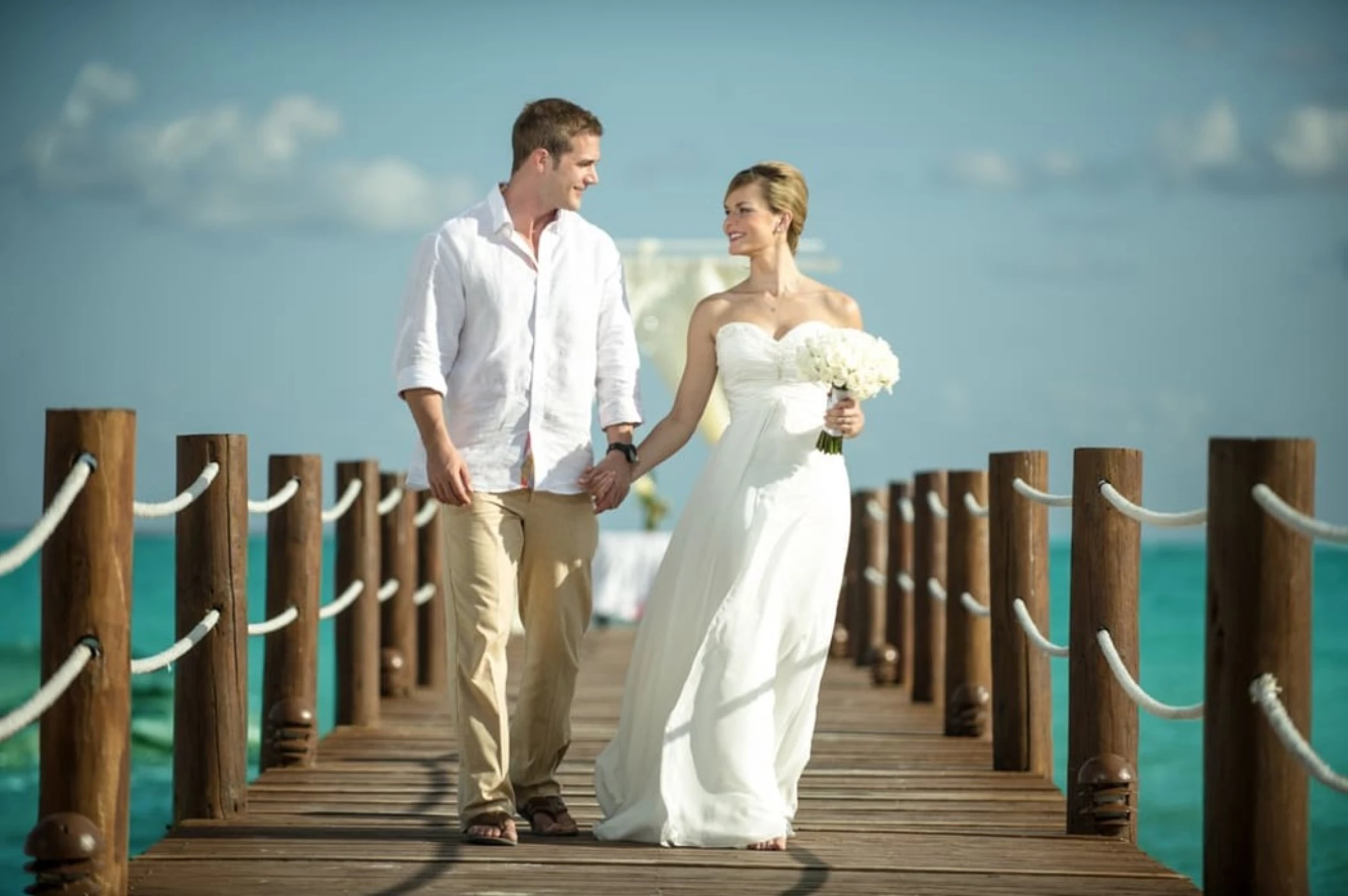 bride and groom on the pier venue at Ocean Maya Royale