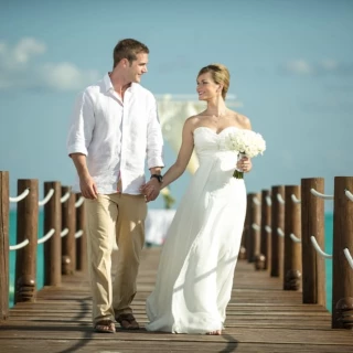bride and groom on the pier venue at Ocean Maya Royale