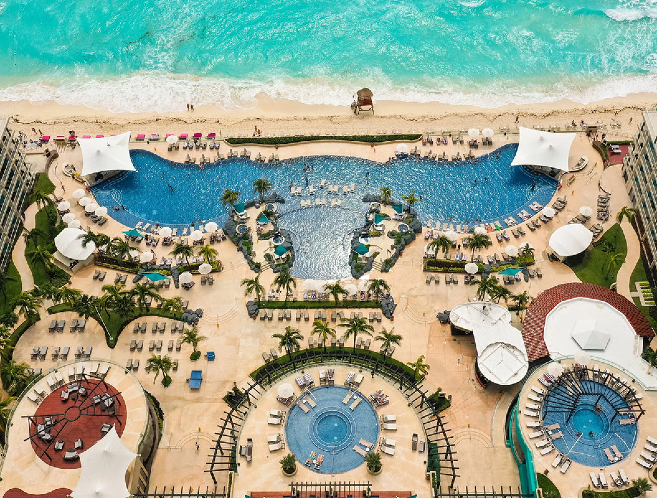 Drone shot of beach and pool of Hard Rock Cancun