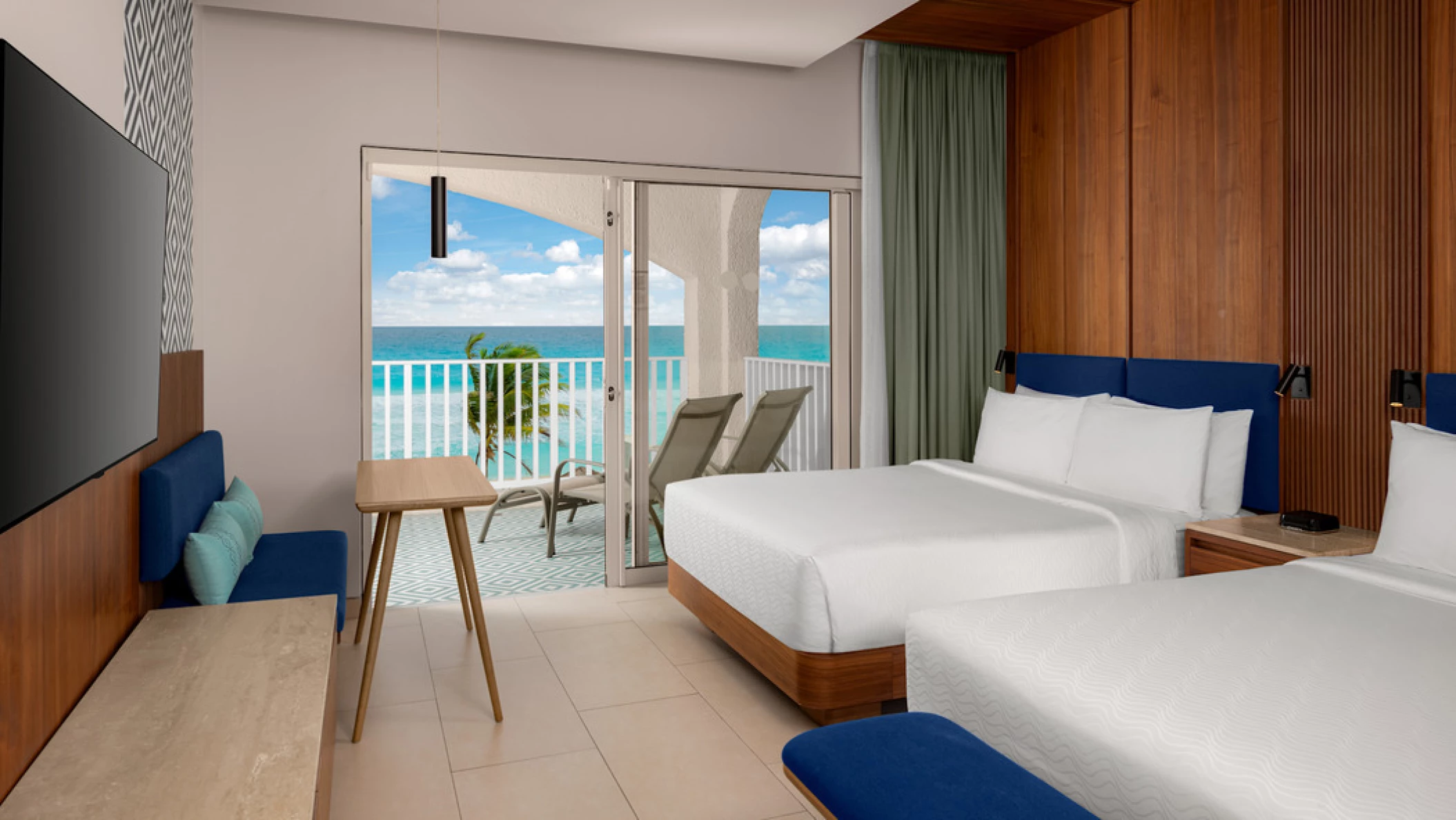 suite with two double beds at Hilton Cancun Mar Caribe