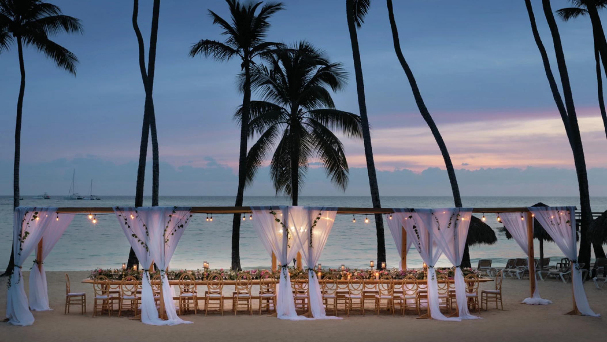 beach area venue with reception setup at Hilton La Romana