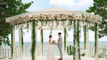 Couple on the wedding gazebo at Hilton La Romana, an All Inclusive Adult Resort