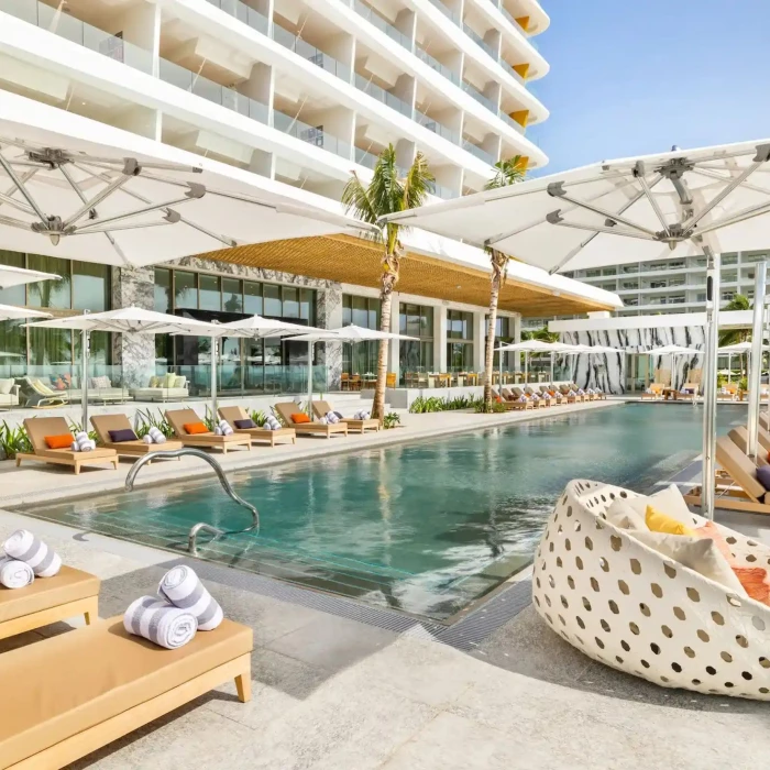pool with loungers at Hotel Mousai Cancun