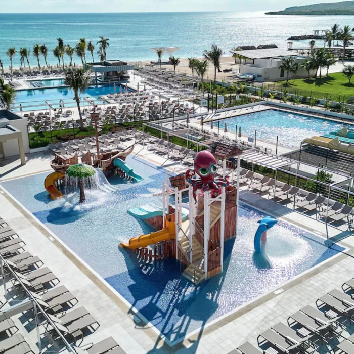 kids waterpark with the main waterpark in the background at Riu Palace Aquarelle Hotel