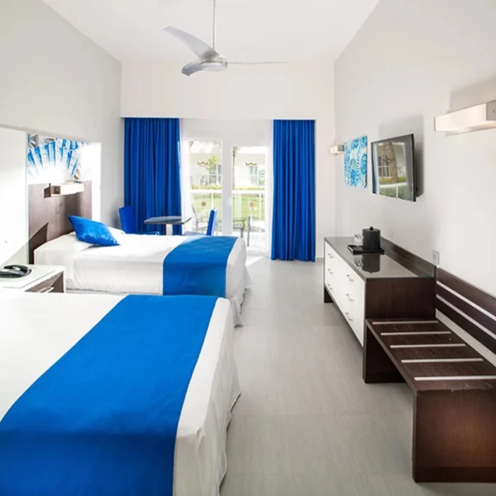 deluxe room with two beds at Hotel Riu Reggae