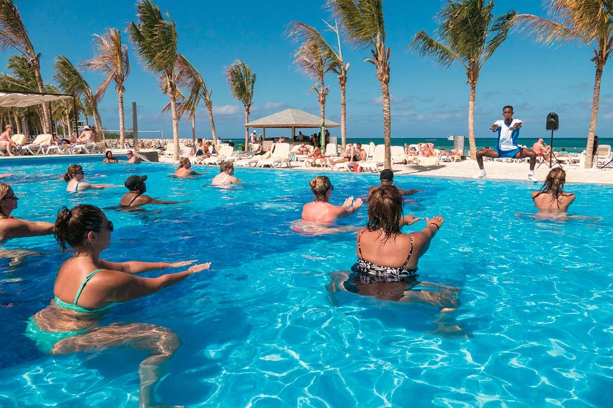 people enjoying aqua aerobics at the oceanfront pool at Hotel Riu Reggae