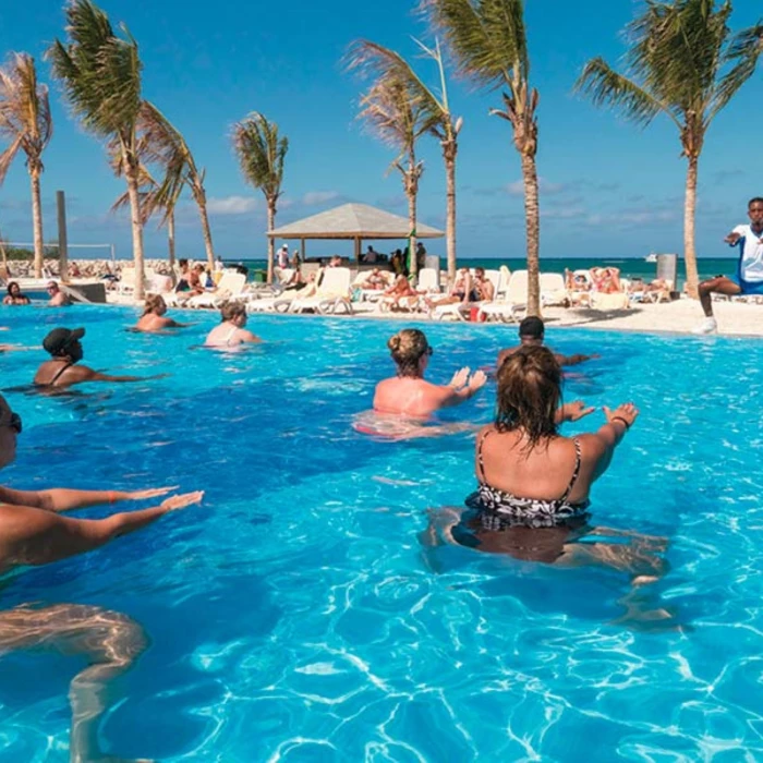 people enjoying aqua aerobics at the oceanfront pool at Hotel Riu Reggae