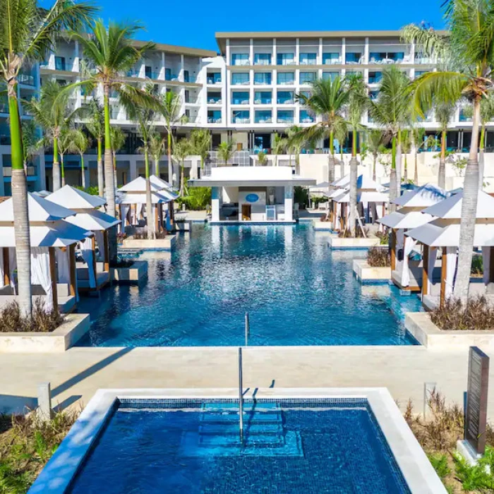 pool and cabanas and resort buildings at Hyatt Zilara Cap Cana