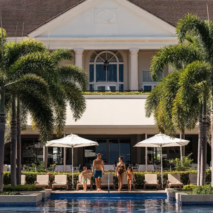 a family at the pool at Hyatt Ziva Rose Hall