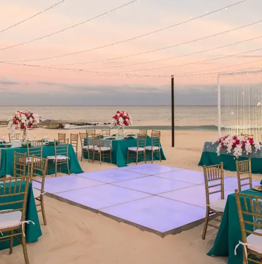 Iberostar Grand Paraiso beach wedding venue with dance floor, tables and chairs