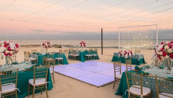 Iberostar Grand Paraiso beach wedding venue with dance floor, tables and chairs