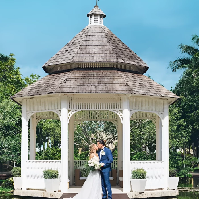 bride and groom at the lake gazebo at Iberostar Selection Hacienda Dominicus