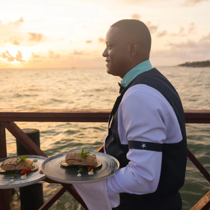 waiter with food at Iberostar Selection Hacienda Dominicus