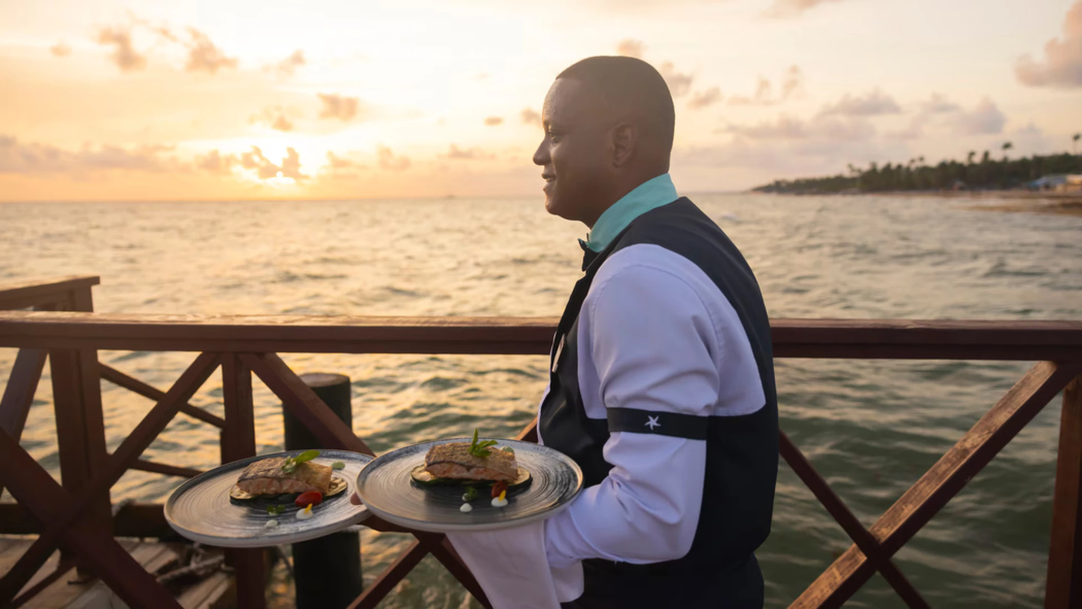 waiter with food at Iberostar Selection Hacienda Dominicus