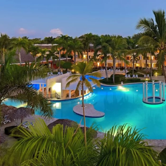 pool lit up in the evening at Iberostar Waves Costa Dorada