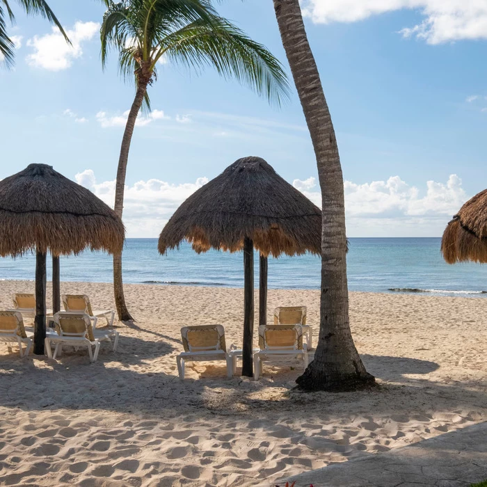 beach palapas at Iberostar Waves Cozumel