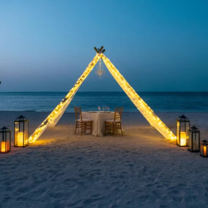 romantic dinner setup on the beach at Iberostar Waves Rose Hall Beach