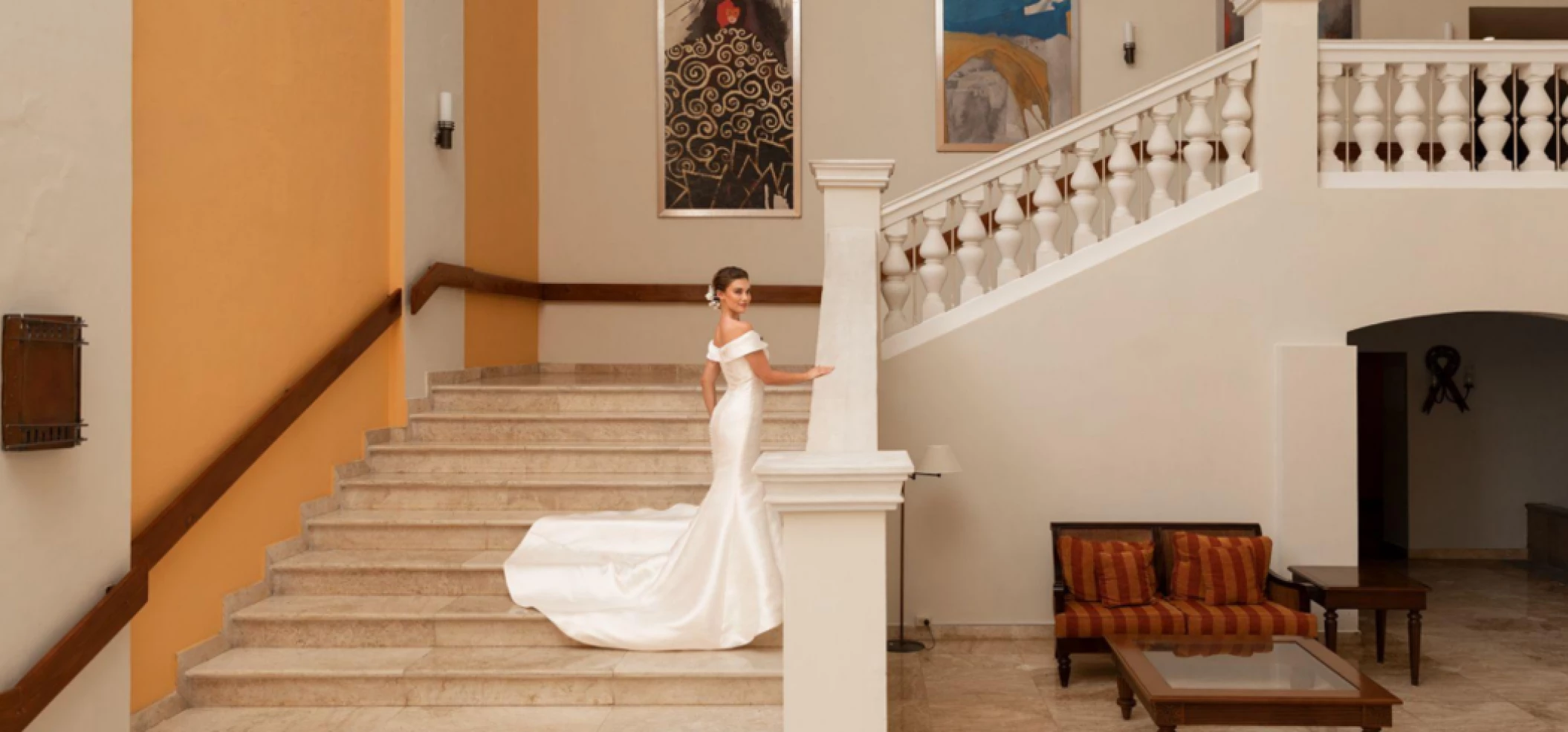 bride standing on the marble staircase venue at Iberostar Waves Rose Hall Beach