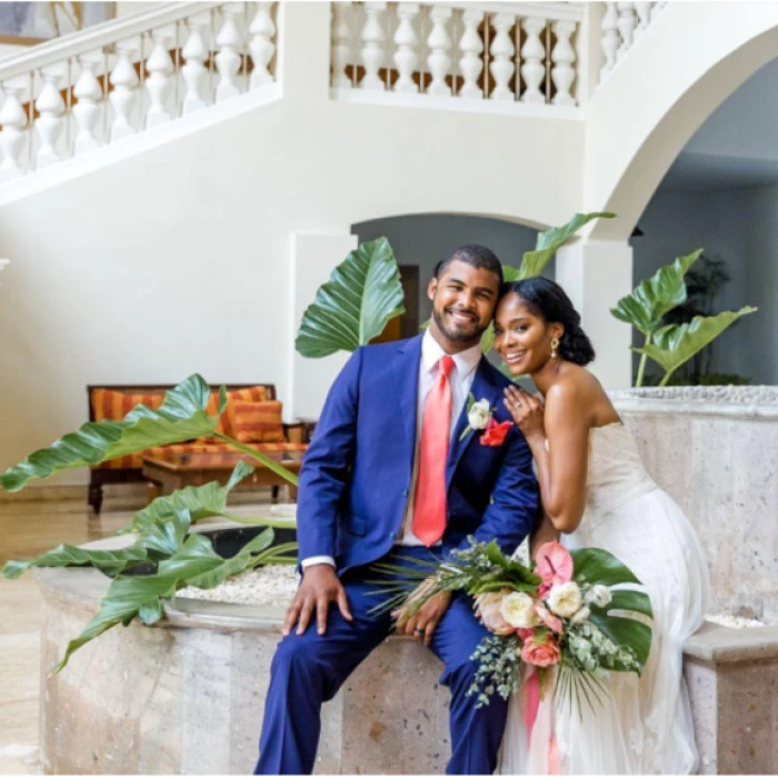 bride and groom at the marble staircase venue at Iberostar Waves Rose Hall Beach