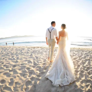 bride and groom on the beach at Margaritaville Beach Resort Playa Flamingo