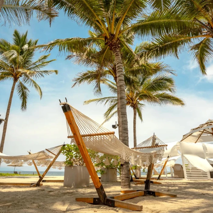 Hammocks on the beach at Marival Distinct Luxury residences.