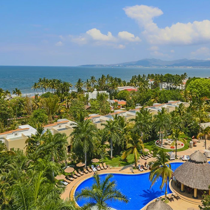 overview shot of the pool gardens and the beach at Marival Distinct Luxury residences.