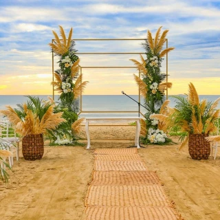 Beach ceremony decor on the beach at Marival Distinct Luxury residences.