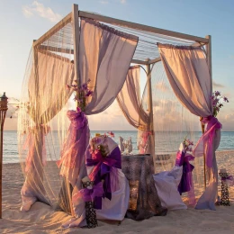 Beach ceremony decor on the beach at Marival Distinct Luxury residences.