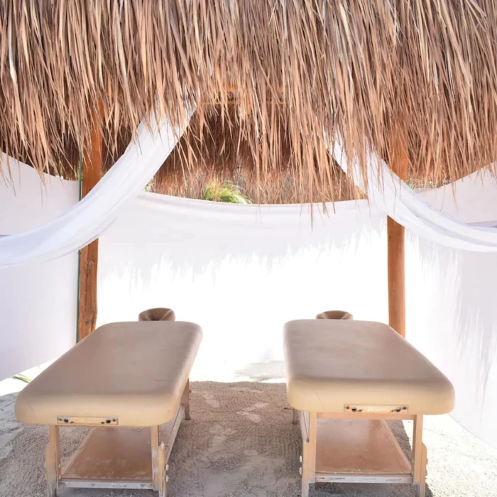 massage tables on the beach at Mystique Holbox by Royalton