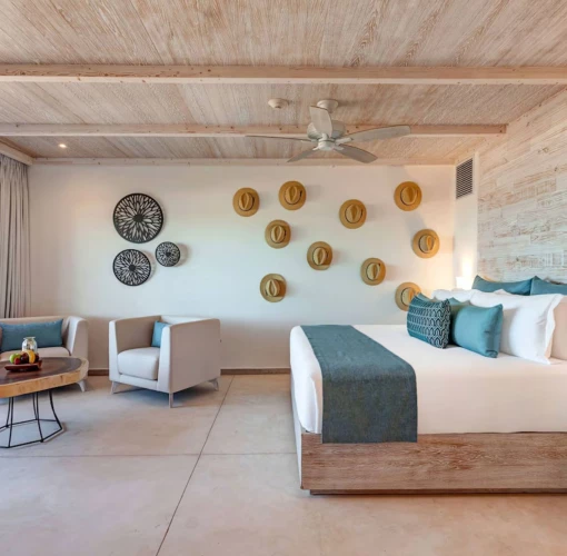 suite with king bed at Mystique Holbox by Royalton
