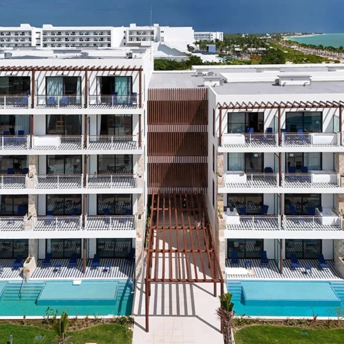 buildings at Ocean Allure Costa Mujeres with balconies and swim out pools visible