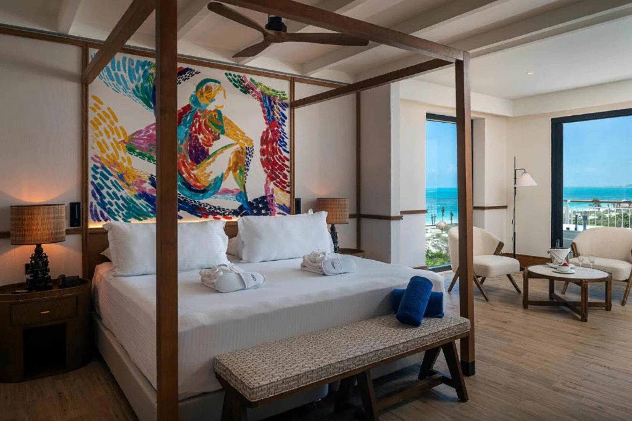 posted bed in suite with ocean views at Ocean Allure Costa Mujeres