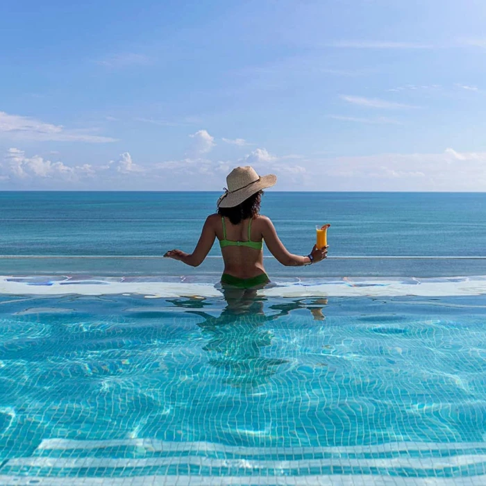 woman in the rooftop pool at Ocean Allure Costa Mujeres
