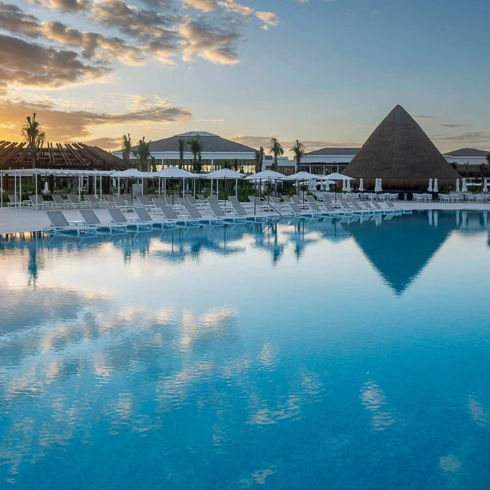 sunset over the pool at Ocean Allure Costa Mujeres