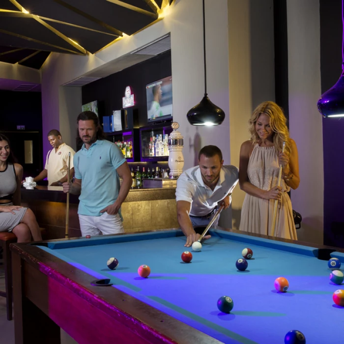 guests playing pool at Royalton CHIC Punta Cana