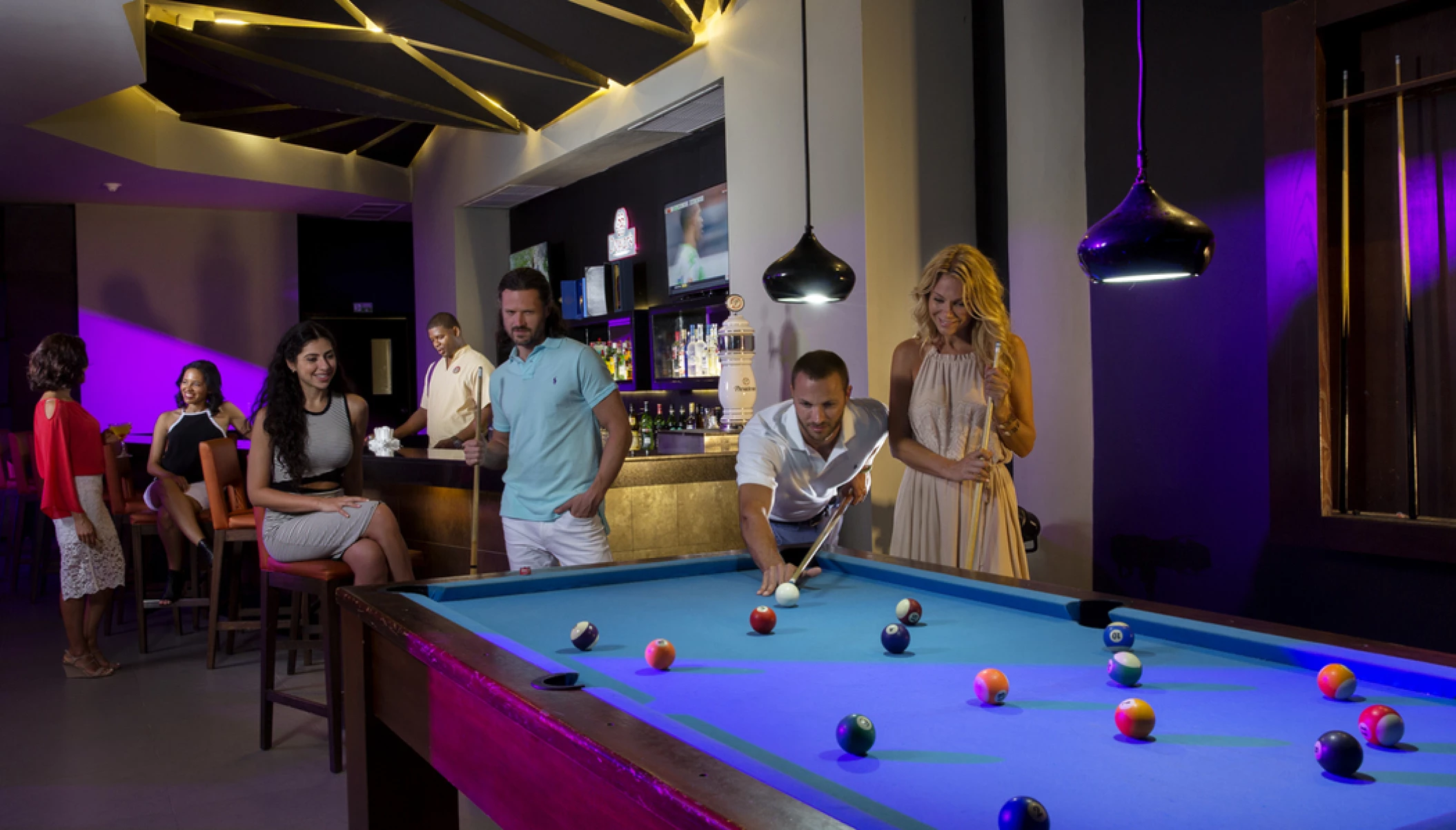 guests playing pool at Royalton CHIC Punta Cana