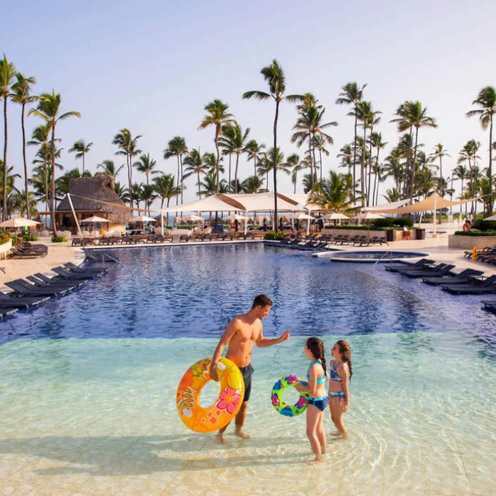 family at the main pool at Royalton Punta Cana