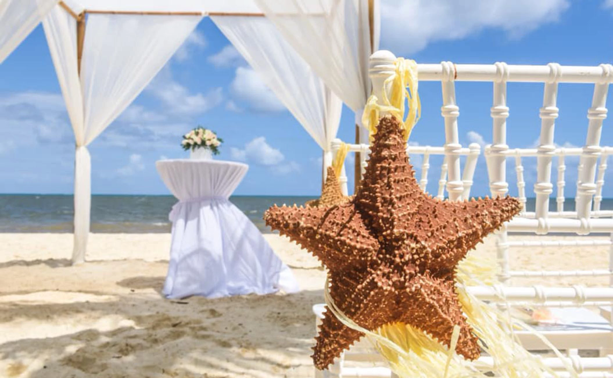 Beach ceremony setup at Royalton Riviera Cancun Resort.