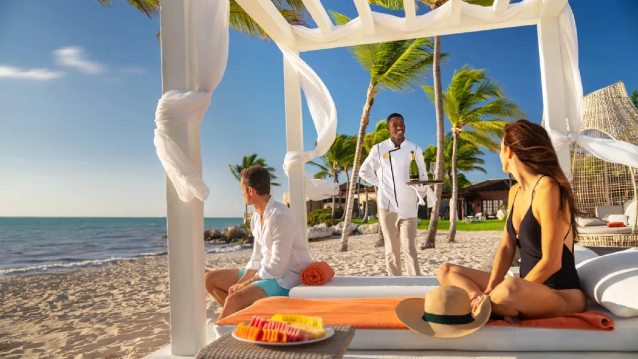 couple enjoying beachside service at Sanctuary Cap Cana