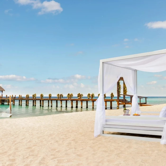 beach pier and bali bed at Secrets Aura Cozumel