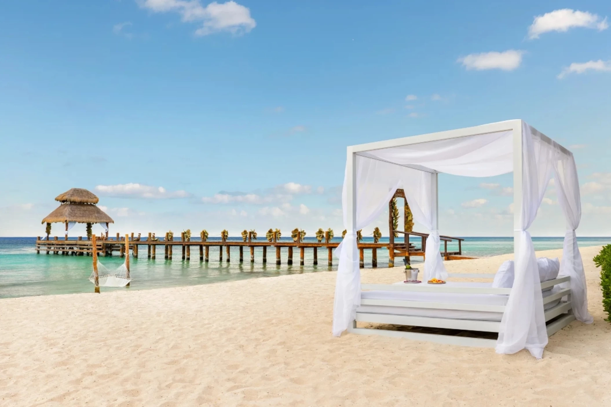 beach pier and bali bed at Secrets Aura Cozumel