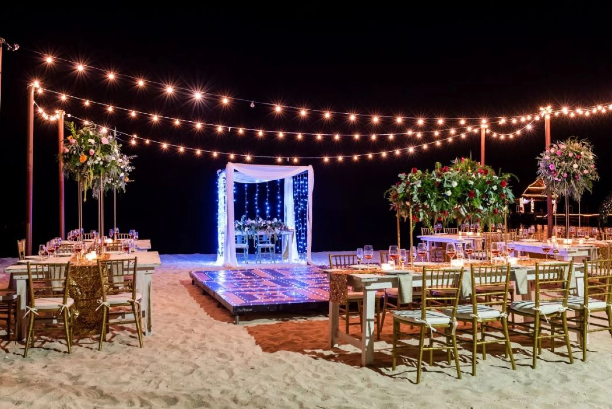 beach venue reception dinner setup at Secrets Aura Cozumel