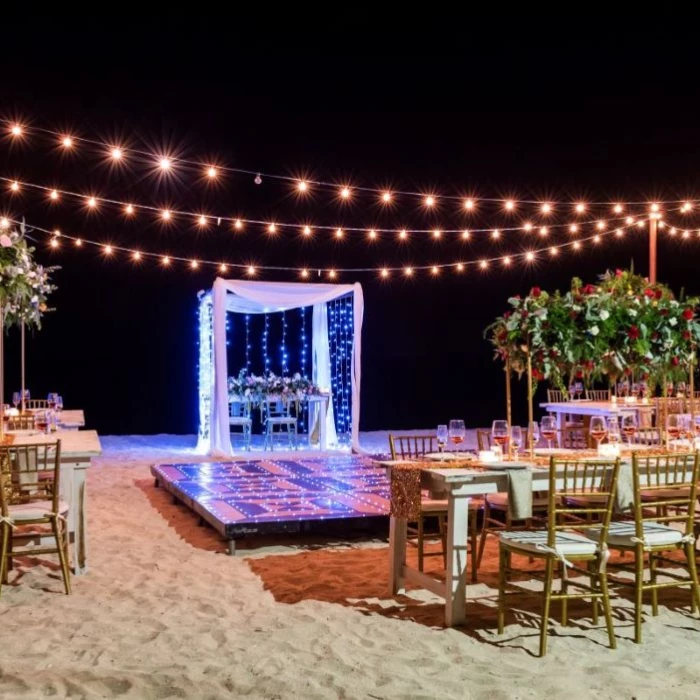 beach venue reception dinner setup at Secrets Aura Cozumel