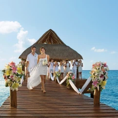 bride groom and guests at the pier venue at Secrets Aura Cozumel