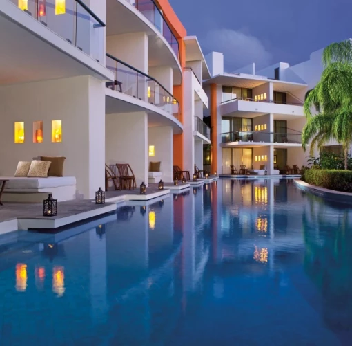 swim out suites at night at Secrets Aura Cozumel