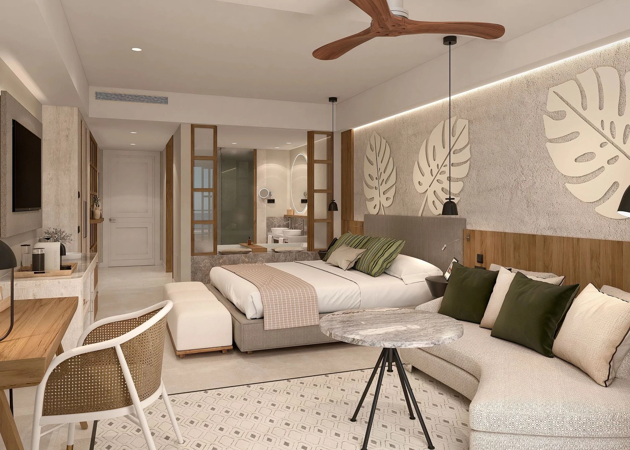 A junior suite with a king-sized bed, a sofa, a ceiling fan, and modern tropical decor.