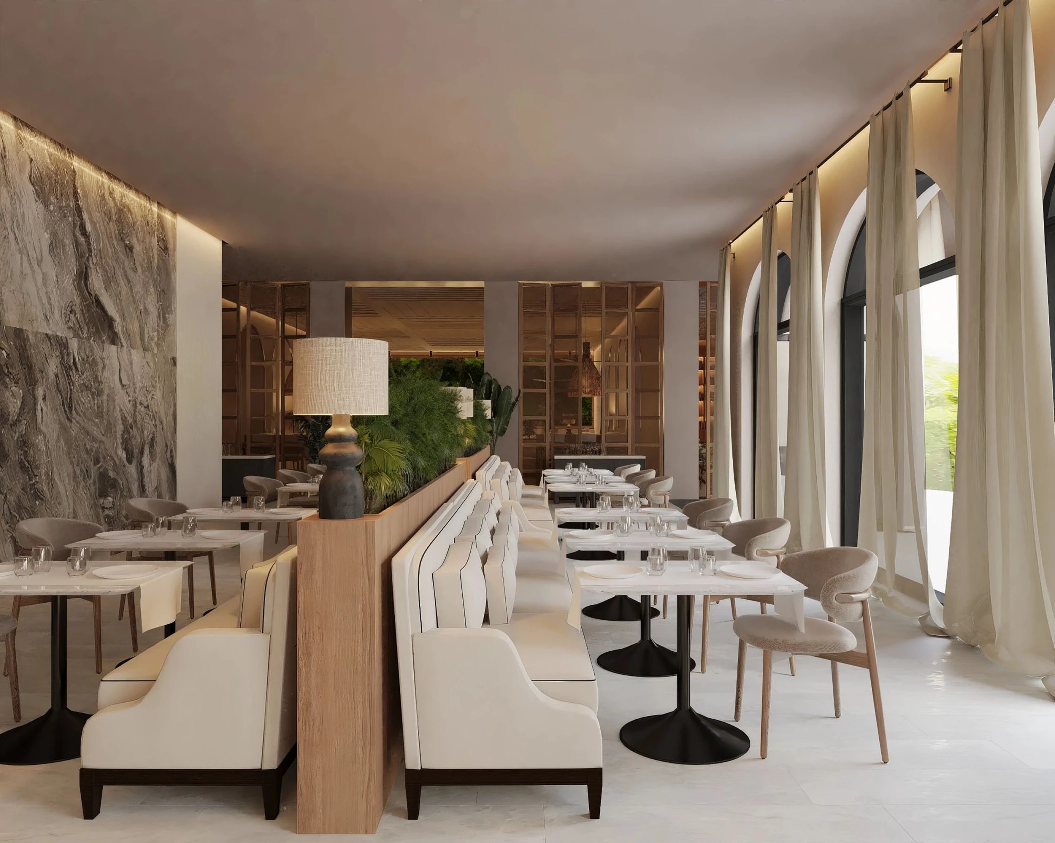 The Market Cafe restaurant, a bright and modern dining space with booths and arched windows with curtains.