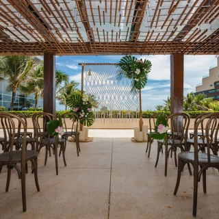 Ceremony setup at The Vine Terrace wedding venue at Secrets The Vine Cancun.