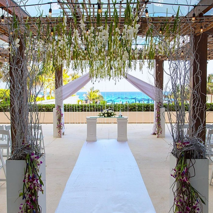 Ceremony setup at The Vine Terrace wedding venue at Secrets The Vine Cancun.